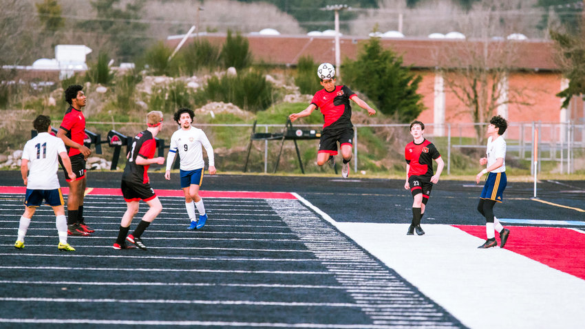Tenino's Salvador Ontiveros (9) makes a header during a game against Forks on Friday at Beaver Stadium.