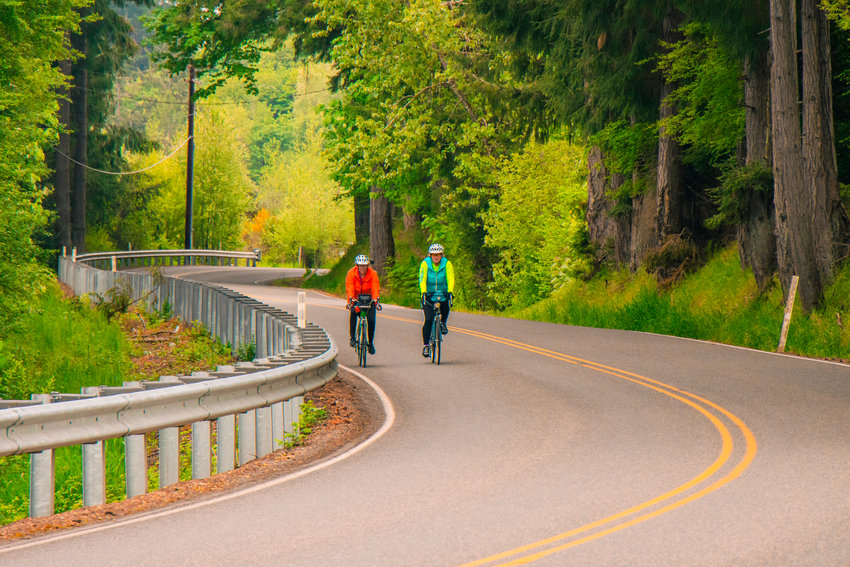 Bicyclists ride along the Lewis County Historical Bike Ride route.