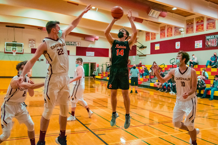 Rainier&rsquo;s Thomas Ronne (14) goes up for a shot during a game against Winlock on Wednesday.