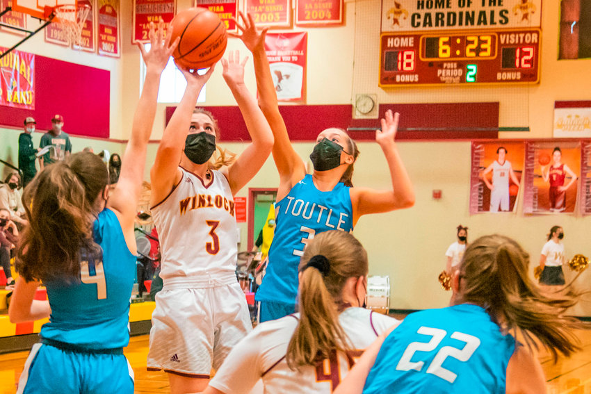 Winlock&rsquo;s Karlie Jones (3) puts up a shot while surrounded by defenders during a game on Thursday.