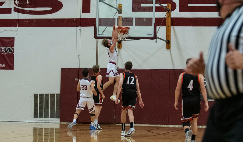 W.F. West senior Carter McCoy throws down a two-handed breakaway dunk against Centralia at home on Wednesday.