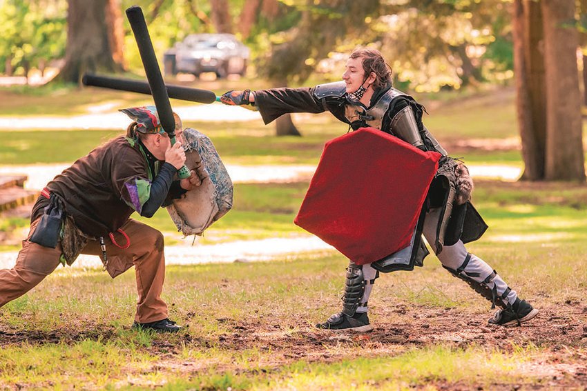 Steven and Kaleb Staggs sport shields during a live-action role play battle in Fort Borst Park on Saturday. Maybe you&rsquo;ve seen similar scenes play out in Fort Borst Park in the past. The live-action role play (LARP) is the work of the Dragons of Fire Valley, one of about nine Western Washington affiliates of Amtgard, &ldquo;a world-wide organization dedicated to medieval and fantasy combat sports and recreation.&rdquo;  Steven Staggs, who plays as Count Runesilver, estimates there are another 12 groups in Eastern Washington. Dragons of Fire Valley meet at 12:30 p.m. every Saturday at Fort Borst Park in Centralia. Anyone interested in participating is welcome to attend. There are on average about 40 members present each week. Saturday marked the group&rsquo;s first outing since the start of the pandemic.