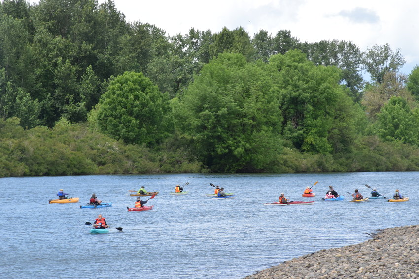 Kayakers and a canoe idle on Lake River in Ridgefield ahead of an afternoon guided paddle, one of two group boating events that were part of 2021&rsquo;s Big Paddle.