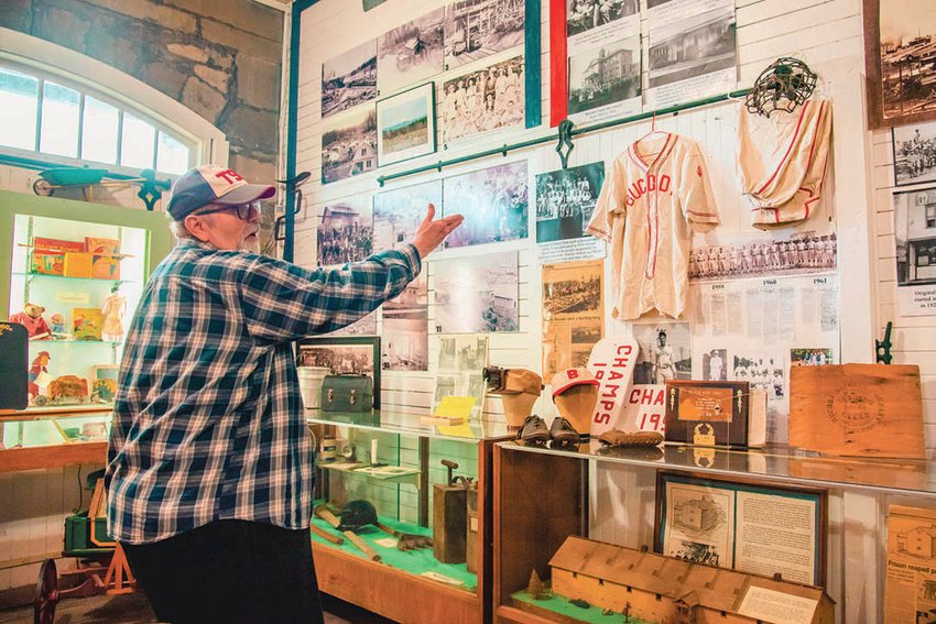 Tenino City Historian Richard Edwards points to items on display in one room of the museum in the Stone City. Edwards will present on his book, &quot;How Tenino got its Name,&quot; at an event on April 13.