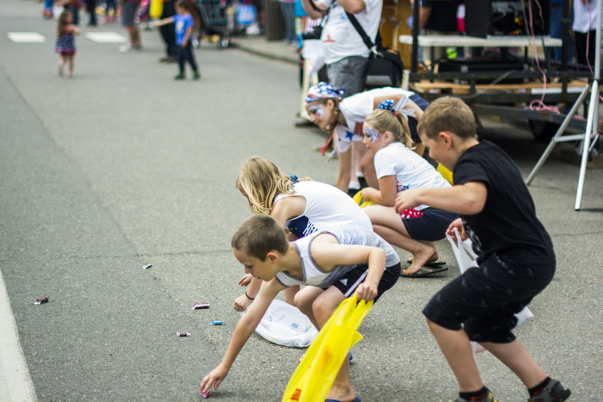 Children scramble for candy at the Pe Ell Independence Day Parade in this 2018 Chronicle file photo.