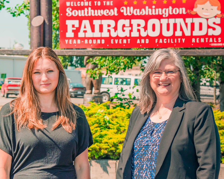 Fair and Events Manager, Fionna Velazquez, left, smiles and poses for a photo in front of the Southwest Washington Fairgrounds with Parks and Recreation Events Director, Connie Riker, Tuesday in Centralia.