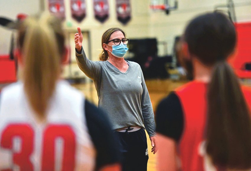 Jennifer Sleeman instucts her team during practice on Monday, May 3, in the Yelm gym.