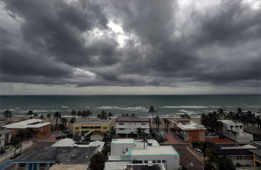 Afternoon thunder clouds roll onto the shore in Hollywood Florida on Tuesday July 6, 2021. South Florida was spared from a direct hit from Tropical storm Elsa which is expected to gain hurricane strength before making landfall somewhere on the west coast of the state north of Sarasota.