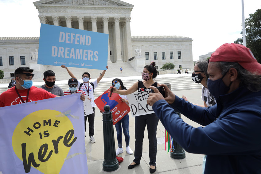 Advocates for immigrants with Deferred Action for Childhood Arrivals, or DACA, rally in front of the U.S. Supreme Court June 15, 2020, in Washington, D.C. A federal judge on Friday ruled that the DACA program was unconstitutional in its implementation.