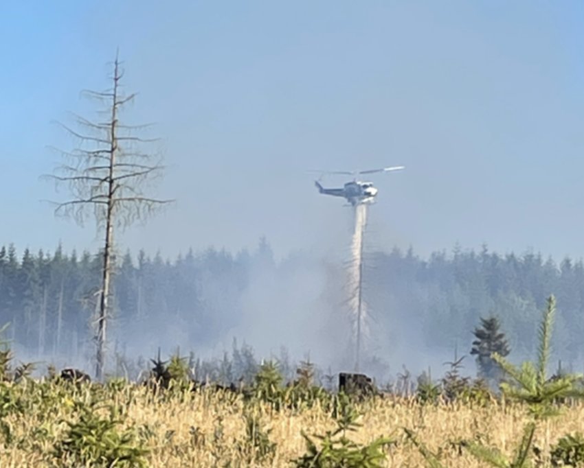 Crews battle the Gish Road fire on Sunday afternoon.