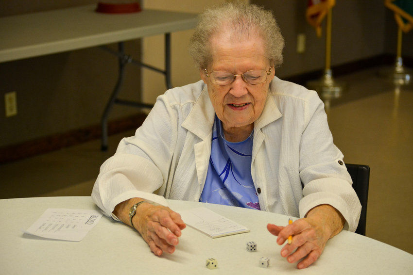 Lucille Gukeisen, one of the Battle Ground Senior Center founders and program organizers, plays bunco.