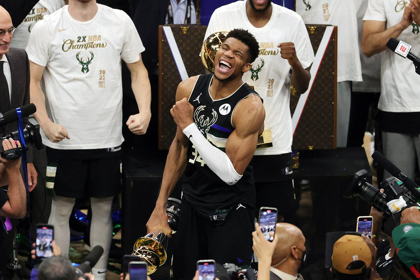 Giannis Antetokounmpo of the Milwaukee Bucks celebrates winning the Bill Russell NBA Finals MVP Award after defeating the Phoenix Suns in Game 6 to clinch the NBA championship at Fiserv Forum on Tuesday, July 20, 2021, in Milwaukee.