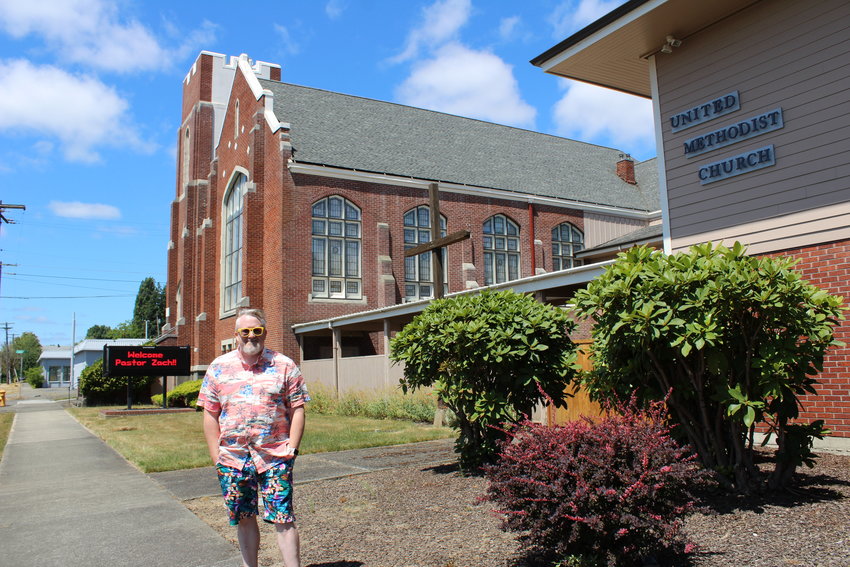 Rev. Zachary Taylor, who became pastor at Chehalis United Methodist Church July 1 stands in front of the Market Street church. Taylor said he generally dresses down when at work as a way to be more approachable, especially to people who may not have a lot of experience interacting with clergy.