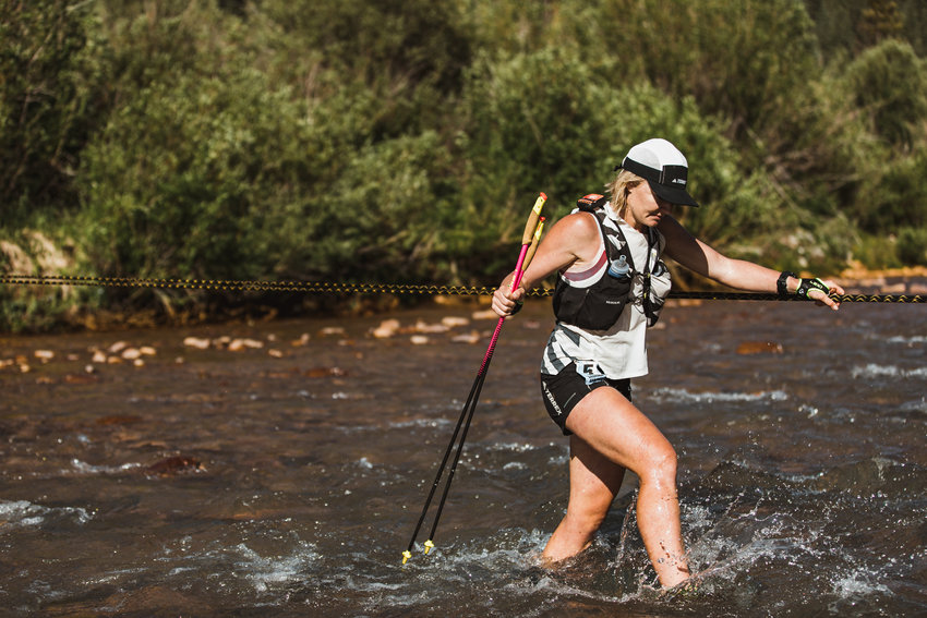 Sabrina Stanley, a 2008 Onalaska graduate, wades throught a river during the Hardrock 100 ultramarathon on July 16, 2021. Stanley would go on to win the 100-mile race.