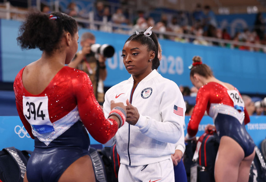 Simone Biles talks with Jordan Chiles of Team United States during the Women's Team Final on day four of the Tokyo 2020 Olympic Games at Ariake Gymnastics Centre on July 27, 2021, in Tokyo, Japan.