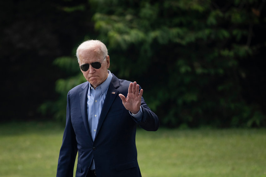 U.S. President Joe Biden waves as he walks to Marine One on the South Lawn of the White House on Wednesday, July 21, 2021, in Washington, D.C. Biden is traveling to the Cincinnati, Ohio area to visit a training center for the International Brotherhood of Electrical Workers and for a town hall event with CNN. (Drew Angerer/Getty Images/TNS)