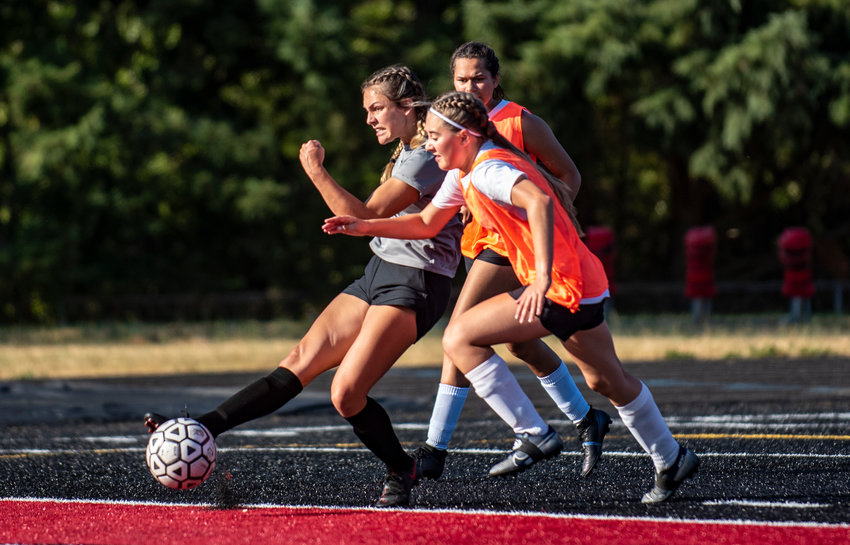 Tenino's Emma Barr, left, boots her second goal of the night in the 25th minute of a 4-0 victory over Rochester in the opening match of the Battle on the Black Top soccer tournament Thursday in Tenino.