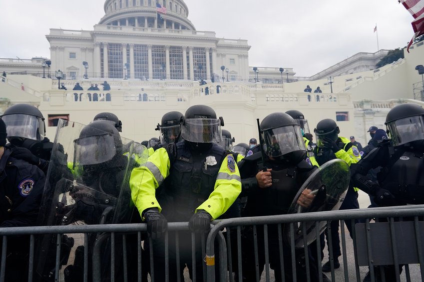 Police try to hold back protesters who gathered to storm the U.S. Capitol and halt a joint session of the 117th Congress on Jan. 6, 2021, in Washington, D.C. (Kent Nishimura/Los Angeles Times/TNS)