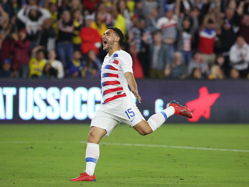 Team USA's Cristian Roldan (15) screams in celebration after a U.S. goal against Ecuador during a friendly at Orlando City Stadium on March 21, 2019, in Orlando, Florida.