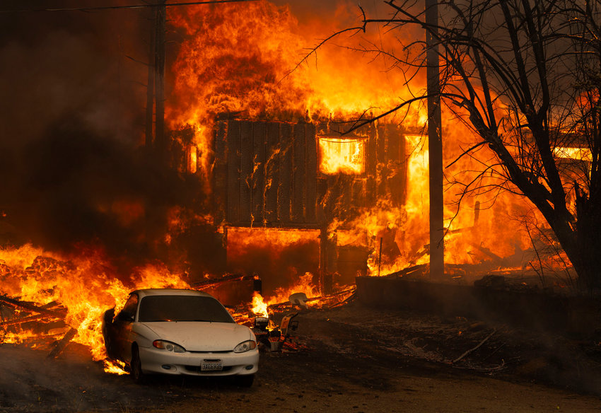 A home burns on Highway 89 south of Greenville, California, near Forgay Road during the Dixie fire on Aug. 5, 2021. (Nathaniel Levine/Sacramento Bee/TNS)