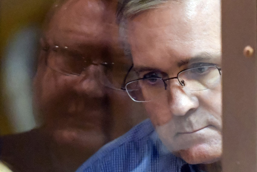 Paul Whelan, a former U.S. Marine accused of espionage and arrested in Russia, listens to his lawyers while standing inside a defendants' cage in a Moscow courtroom during a hearing on Jan. 22, 2019. (Mladen Antonov/AFP/Getty Images/TNS)