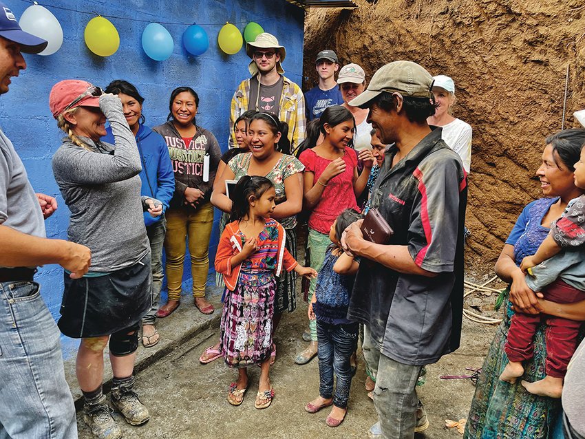 A Guatemalan family receives the keys to their newly built home in this photograph provided by Neal Kirby.