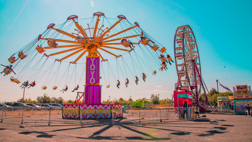 Carnival rides swing passengers around at the Southwest Washington Fairgrounds Wednesday in Centralia.