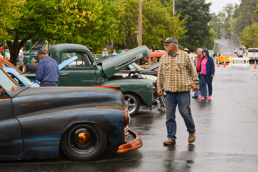 About 50 cars and two antique tractors filled the streets next to La Center Church for a cruise-in organized by the La Center Farmers Market on Thursday, Aug. 26.