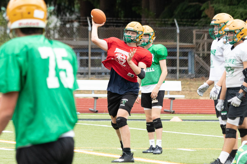 Tumwater junior quarterback Alex Overbay tosses a pass during practice o Thursday.