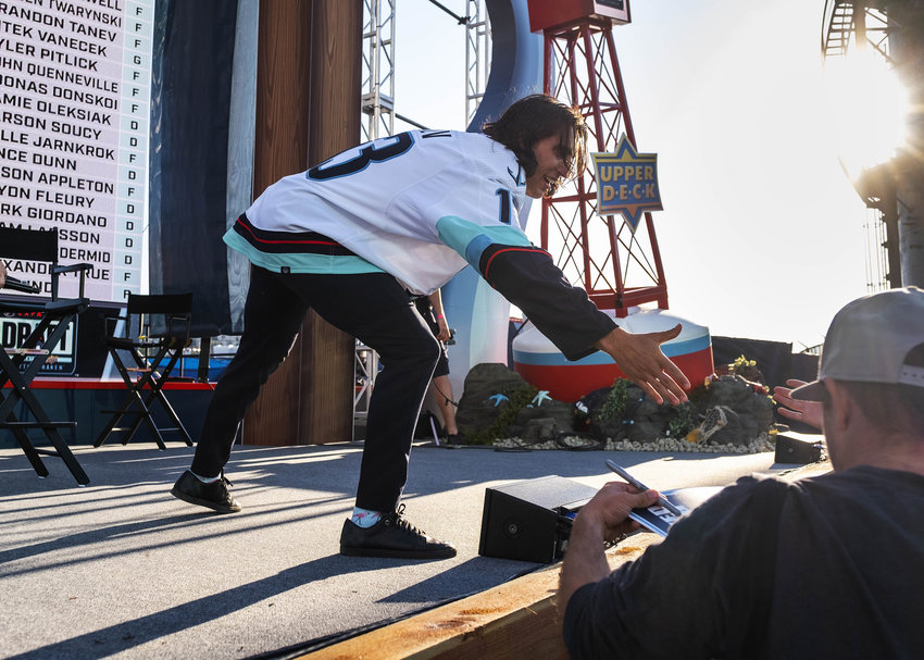 Brandon Tanev reaches for a fan's hand during the NHL Expansion Draft for the Seattle Kraken on July 21, 2021 at Gas Works Park in Seattle.