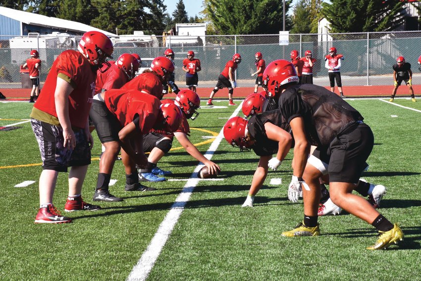 The Tornados line up for a scrimmage at practice on Wednesday, Sept. 1, at Yelm High School.