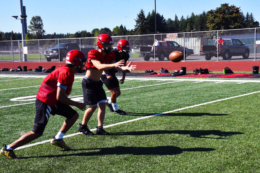 The Tornados run some offensive drills at practice on Wednesday, Sept. 1, at Yelm High School.