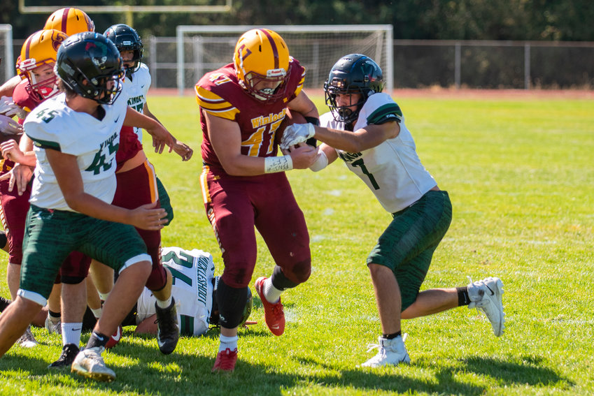 FILE PHOTO -- Winlock tailback Nolan Swofford (47) breaks through for a 4-yard touchdown run against Muckleshoot Tribal on Saturday.