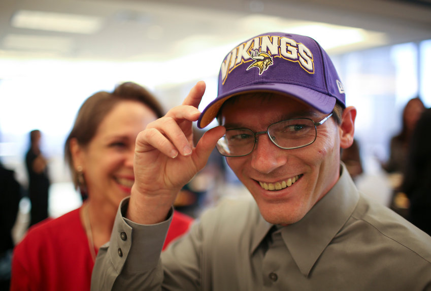 A Minnesota Vikings cap was one of the gifts Damon Thibodeaux received at a reception at Fredrikson &amp; Byron to welcome him to Minneapolis on October 12, 2012. (Jeff Wheeler/Minneapolis Star Tribune/TNS)