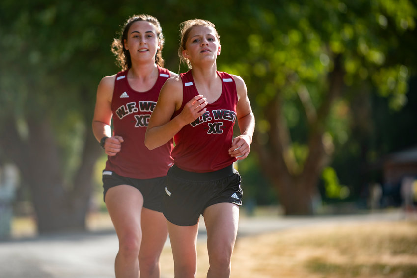 W.F. West freshman Mercedes Ricks, right, placed first in a dual meet with Centralia at Stan Hedwall Park on Wednesday. Teammate Elaina Koenig, left, place second.