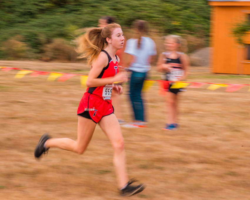 FILE PHOTO -- Toledo&rsquo;s Karley Harris runs towards the finish line during a cross country meet on Sept. 16, 2021.