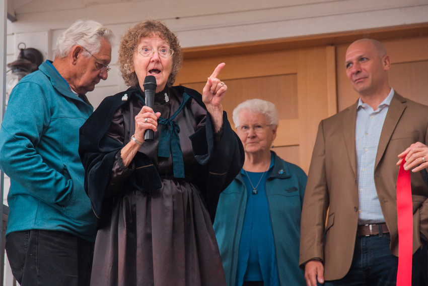 Jean Bluhm talks to attendees of a ribbon-cutting ceremony for the Borst Park Pioneer Church in Centralia in September 2021.
