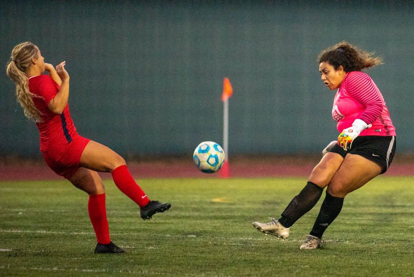 FILE PHOTO - Centralia College keeper Marisol Vargas, right, clears the ball against Lower Columbia College earlier this season.