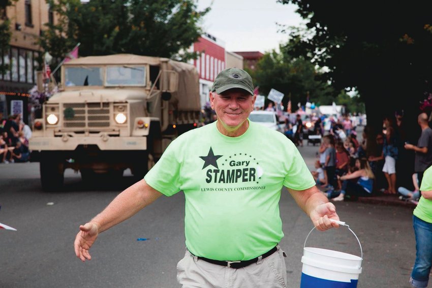 Lewis County Commissioner Gary Stamper smiles while walking in a parade in Centralia in this photo provided by his partner, Bobbi Barnes.