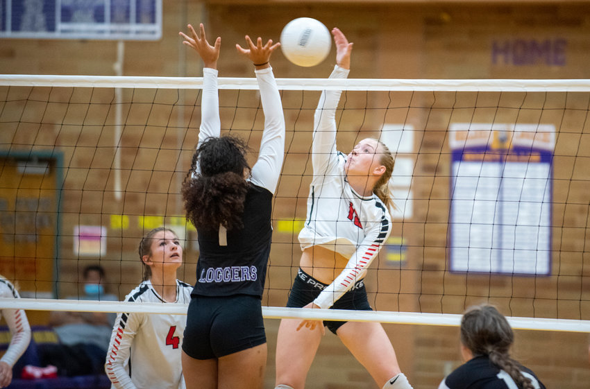 FILE PHOTO -- Mossyrock&rsquo;s Hailey Brooks (15) and Onalaska&rsquo;s Jen Lispey (1) battle at the net on Sept. 25.