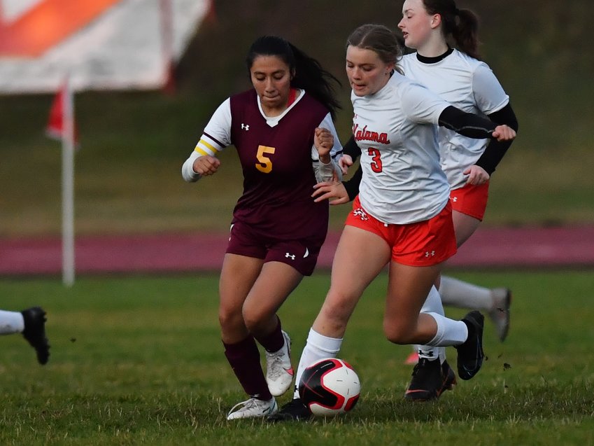Winlock&rsquo;s Angela Gil-Munoz fights for possession against Kalama&rsquo;s Josie Brandenburg in the second half of the Chinooks&rsquo; 8-0 win over the Cardinals on Sept. 27.