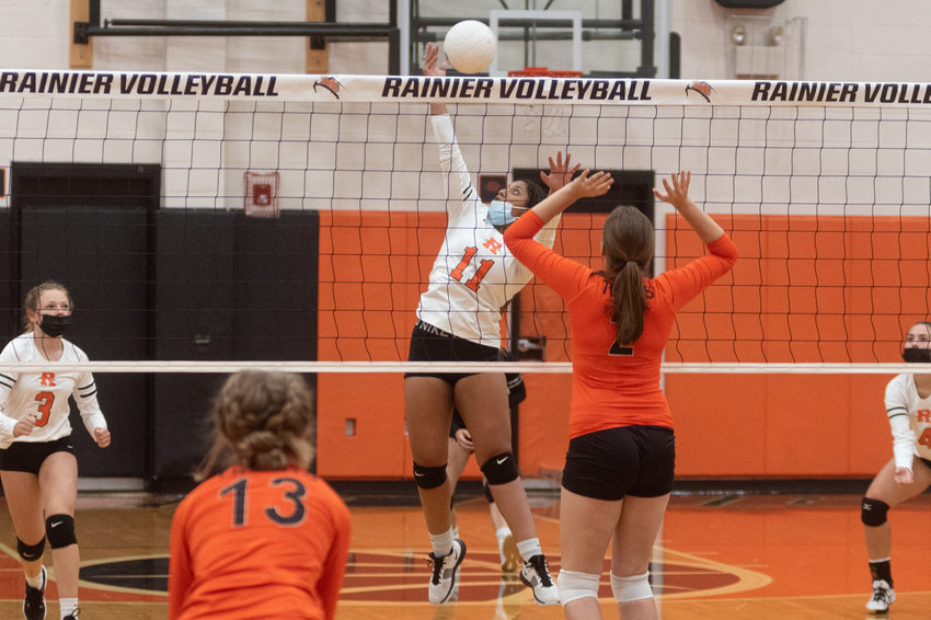 FILE PHOTO -- Rainier senior setter Ilanys Osorio hits the set-winning kill in the first set of the Mountaineers match against Napavine Monday night.