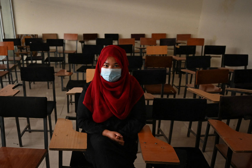 A student sits inside a classroom after private universities reopened in Kabul, Afghanistan, on Sept. 6, 2021. The Taliban said this week that female students won't be able to return to Kabul University until &quot;a real Islamic environment&quot; is provided for all. (Aamir Qureshi/AFP/Getty Images/TNS)