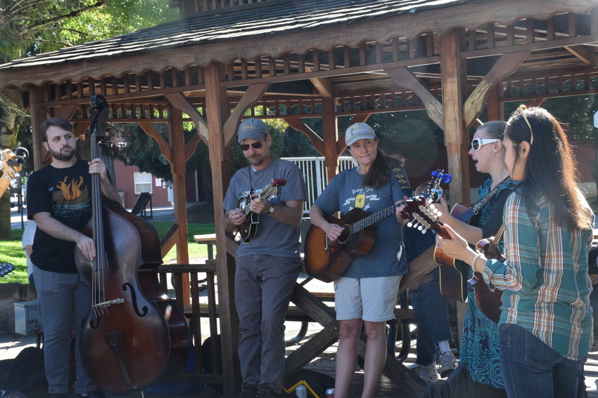 Musicians play in downtown Ridgefield as part of the city&rsquo;s Birdfest and Bluegrass event on Oct. 2