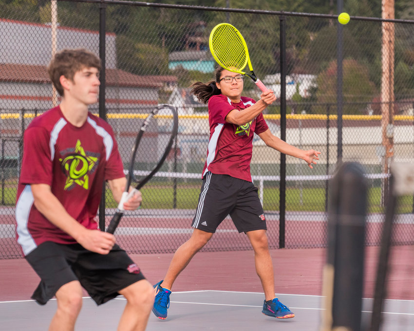 W.F. West&rsquo;s Joseph Chung returns a ball during a doubles match with Aaron Boggess in Chehalis Wednesday afternoon.