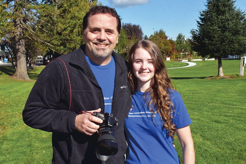 Adam and Ashley Cunningham, of Adam Cunningham Photography, pose for a photo at Yelm City Park on Friday, Oct. 8.