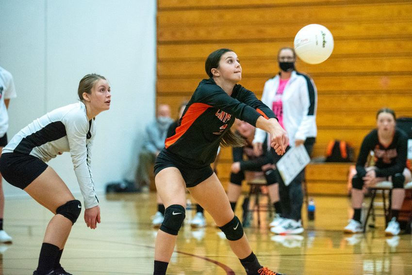 FILE PHOTO -- Centralia's Ella Orr (3) gets in front of a W.F. West serve with Evie Rooklidge providing backup on Oct. 12, 2021.