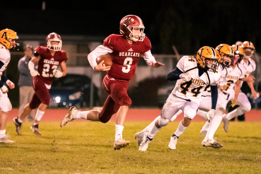 W.F. West&rsquo;s Gavin Fugate (9) runs with the football during a game against Aberdeen Friday night at Bearcat Stadium in Chehalis.