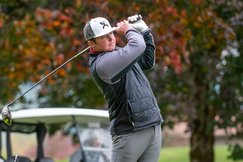 W.F. West's Tukker Rosbach tees off on the 18th hole at the 2A Evergreen Conference championships at Riverside Golf Course on Oct. 18, 2021.