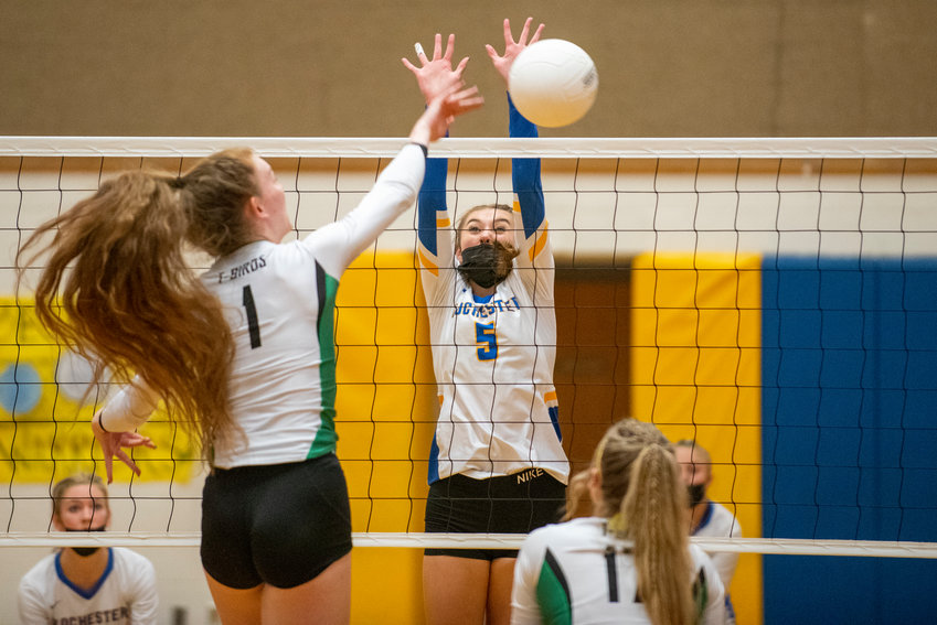 Tumwater's Alyssa Duncan (1) spikes against Rochester's Roisin Stull (5) during a 2A Evergreen Conference match in Rochester on Oct. 19, 2021.